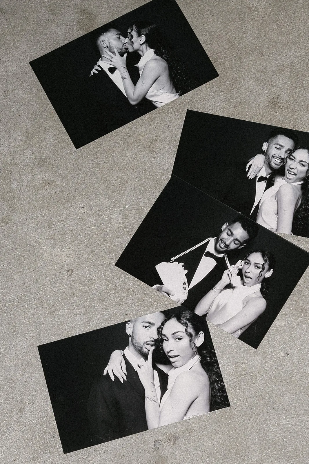 Keepsake prints from the photo booth laid out on a table